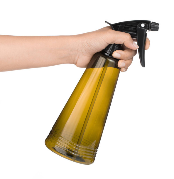Hand holding yellow plastic spray bottle isolated on white backg - Φωτογραφία, εικόνα