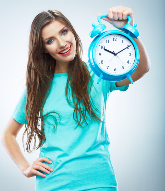 Young smiling woman hold watch. Beautiful smiling girl portrait - Фото, изображение