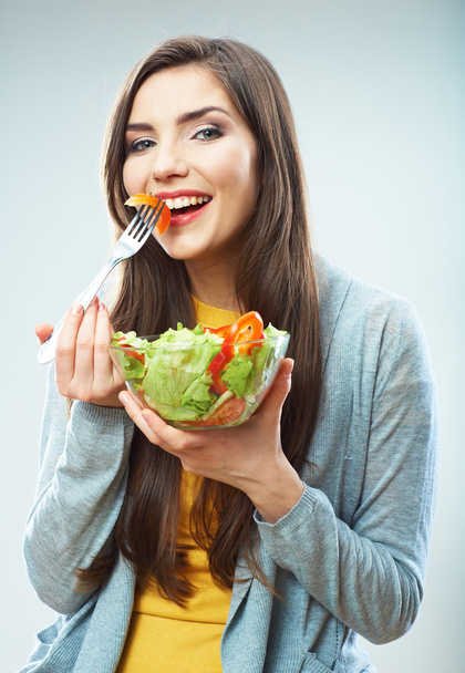 Woman eating salad - Фото, изображение