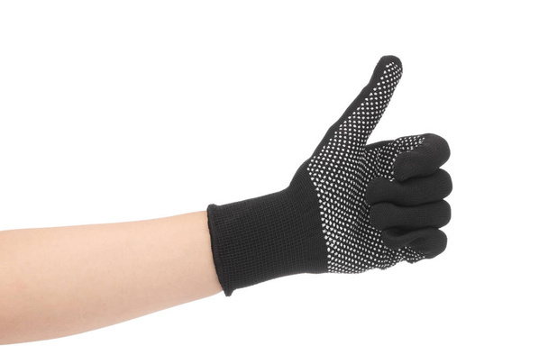Main en gants noirs montrant le signe du pouce isolé sur le dos blanc
 - Photo, image