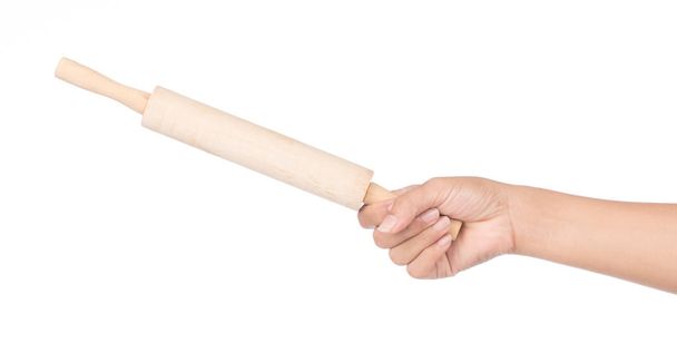 hand holdinmg wood rolling pin isolated on white background - Photo, Image