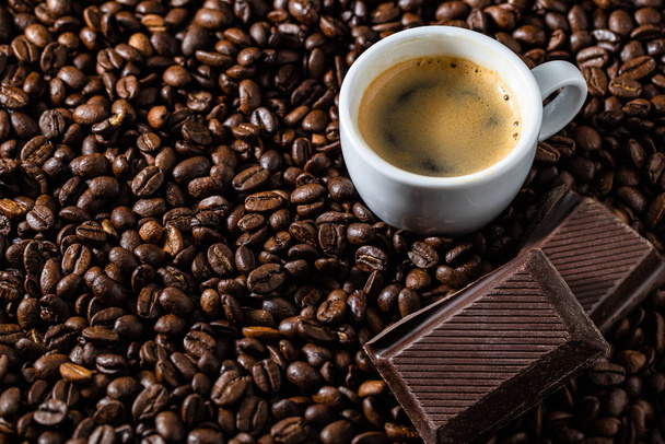 Coffeebeans with a cup of espresso close up - Φωτογραφία, εικόνα