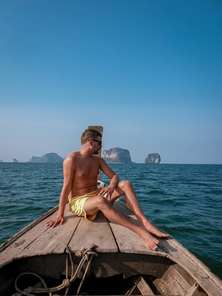 man in swim short in Krabi Thailand, guy on vacation Railay beach Ao Nang krabi Asia - Foto, afbeelding
