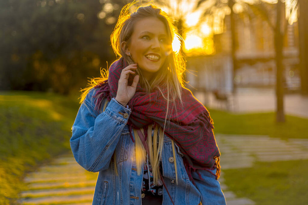 street portrait of young blonde woman at sunset  - Foto, Imagem