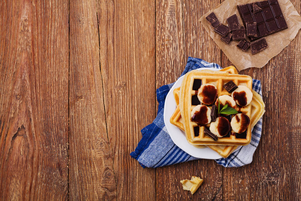 Delicious waffles with banana and chocolate - 写真・画像