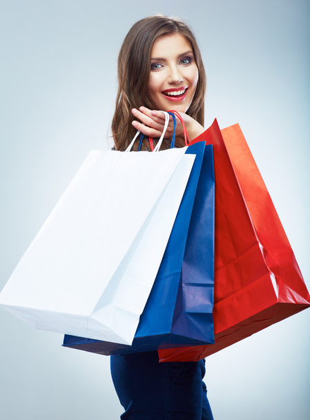 Smiling woman holds shopping bags - Фото, изображение