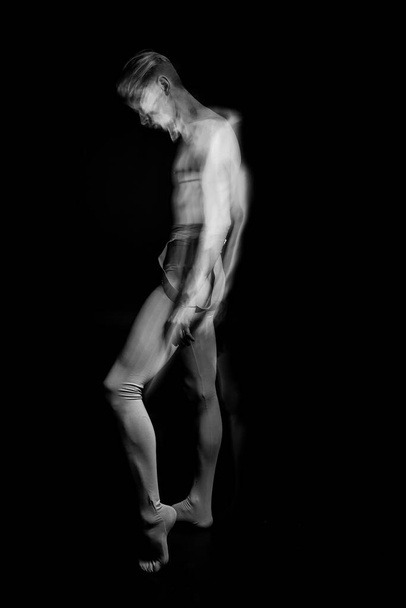 profile professional dancer with naked torso. Long exposure creative emotional series of photos. Black and white artistic work about feelings. sensitive romantic psychology. abstract poster - Foto, immagini
