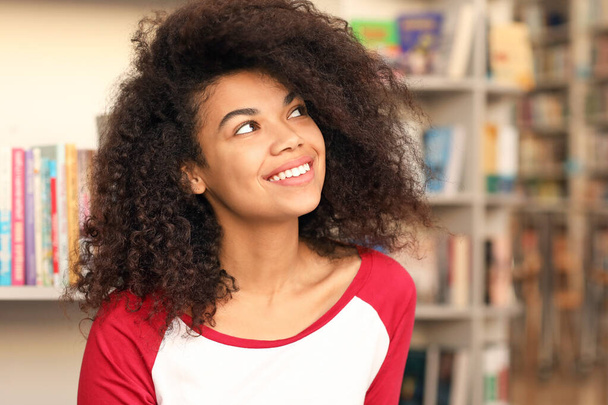 Portrait of African-American student in library - Foto, Bild