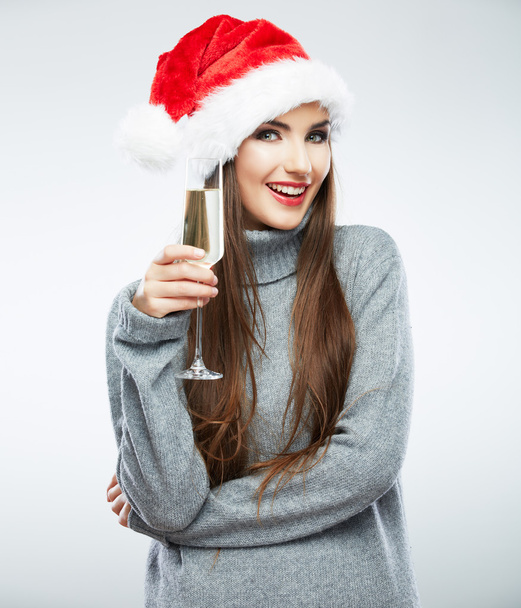 Woman in santa hat holding glass of champagne - Foto, imagen