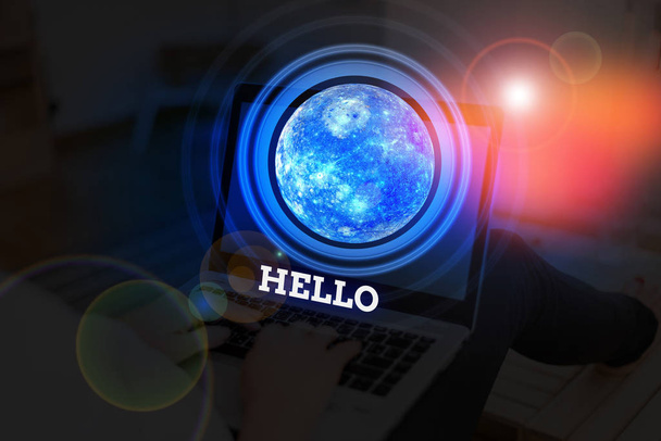 Handwriting text Hello. Concept meaning used as a greeting or to begin a telephone conversation Greet someone Elements of this image furnished by NASA. - Photo, Image