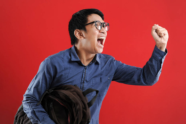 Young asian man happy and excited expressing winning gesture. - Fotoğraf, Görsel