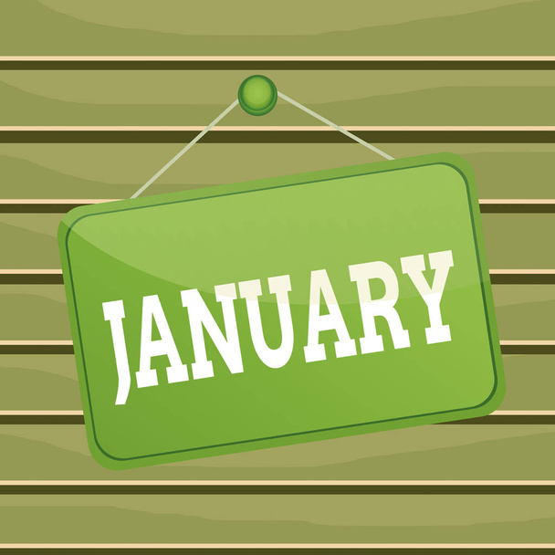 Kavramsal el yazısı Ocak ayını gösteriyor. Yılın ilk ayı iş fotoğrafı metni ve kış hatırlatma panosunun ikinci ayının arka plan dikdörtgenine iliştirilmiş olduğu düşünüldü. - Fotoğraf, Görsel
