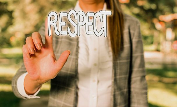 Word writing text Respect. Business concept for Feeling of deep admiration for someone or something Appreciation Business woman in the nature pointing with the finger into empty space. - Photo, Image