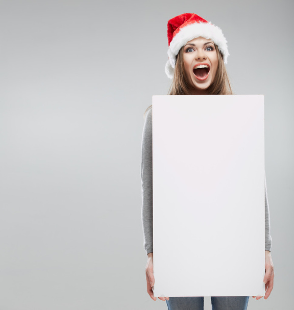 Woman in santa hat holding blank banner - Φωτογραφία, εικόνα