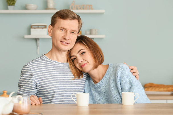 Portrait of beautiful couple in kitchen - Photo, Image