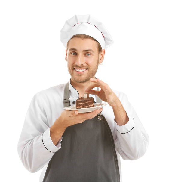 Szczęśliwy kucharz z kawałkiem ciasta na białym tle - Zdjęcie, obraz