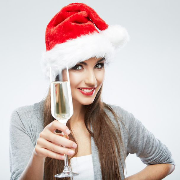 Woman in santa hat holding glass of champagne - Photo, Image