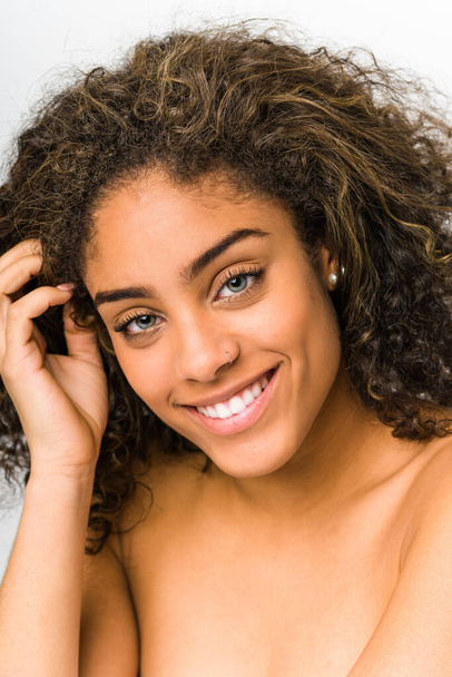 Young african american woman face closeup - Фото, изображение