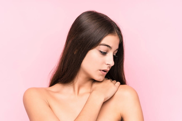 Young beauty caucasian woman against a pink background - Photo, image