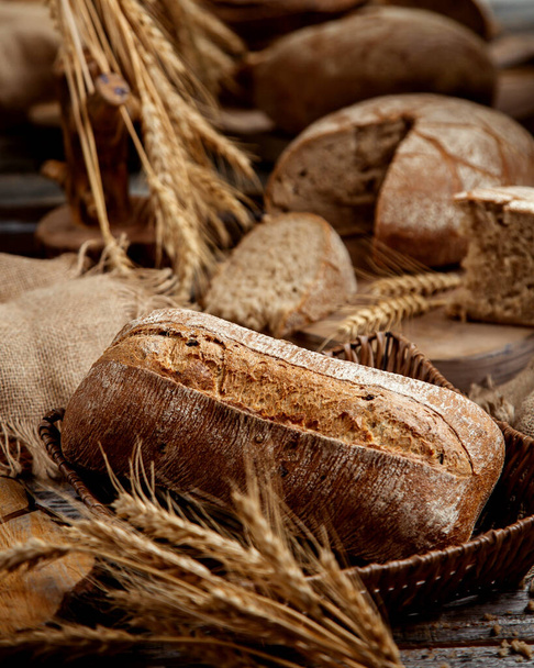 organic whole grain bread decorated with grain ears - Fotó, kép