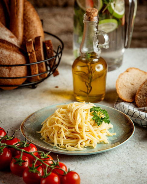 noodles with tomato and olive oil - 写真・画像
