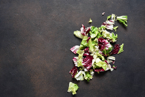 Mix salad, cabbage on a concrete background with place for text. - Photo, image