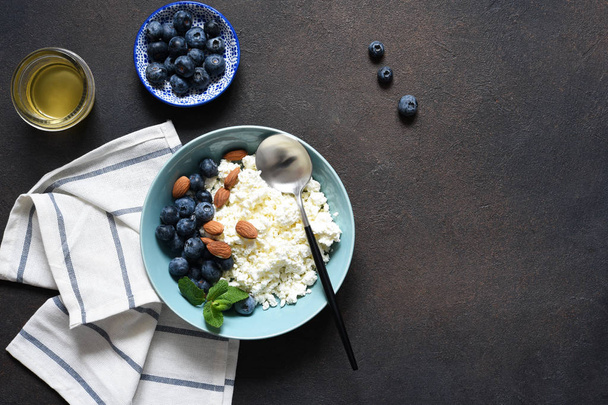 Beautiful breakfast - cottage cheese, berries and honey  - 写真・画像