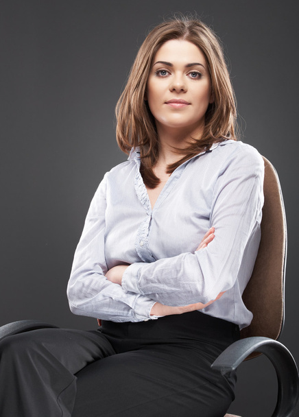 Beautiful business woman sitting in chair - Foto, afbeelding