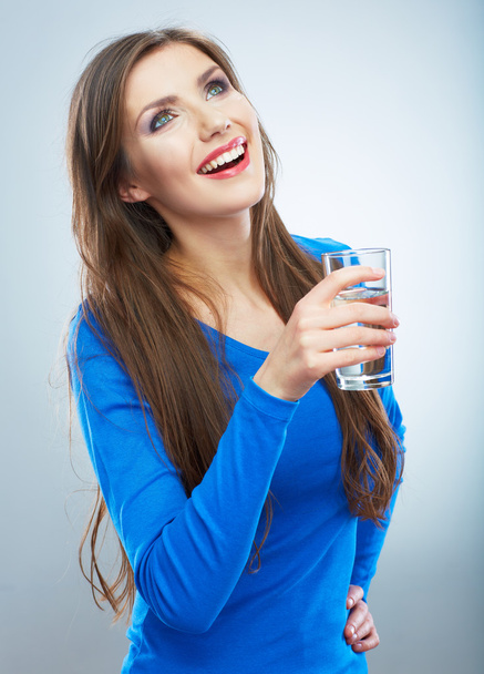 Smiling woman holding water glass - Foto, afbeelding