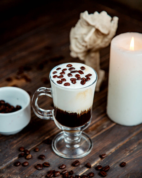 coffee cocktail with whipped cream and coffee beans on top - Фото, изображение