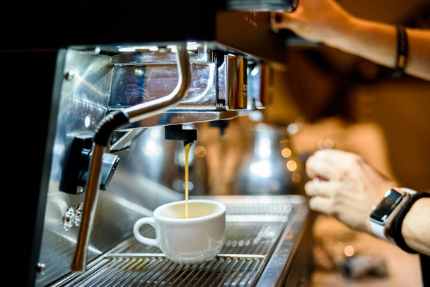 Coffee machine preparing an espresso for customers' breakfast in - Fotó, kép