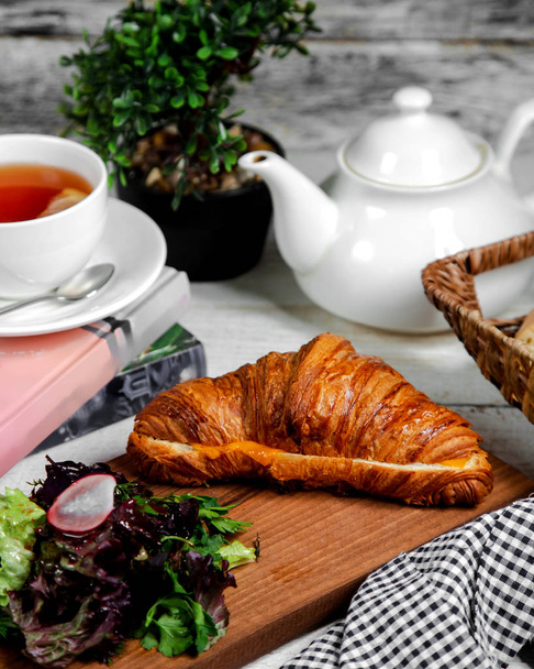 croissant and greenery with tea - Fotoğraf, Görsel