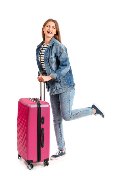 Female tourist with luggage on white background - Foto, imagen