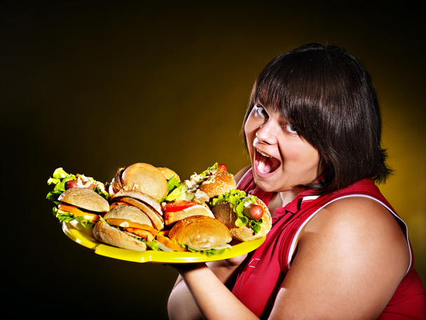Femme tenant hamburger
. - Photo, image