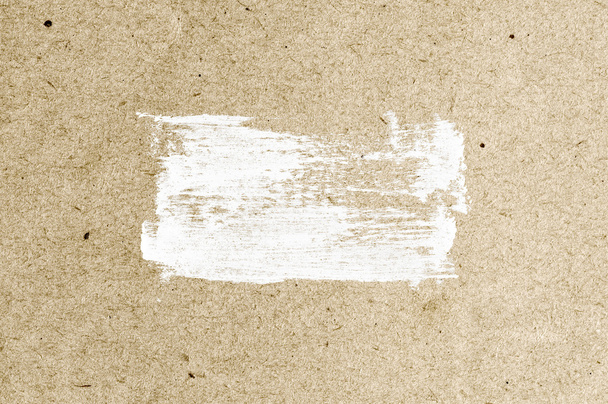White abstract hand-painted brush stroke daub over vintage old paper - 写真・画像
