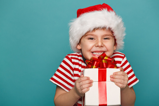 funny child in Santa red - Фото, изображение