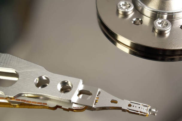 HDD. Inside of hard disk - magnetic disk with a reading head. close-up photo - Photo, Image