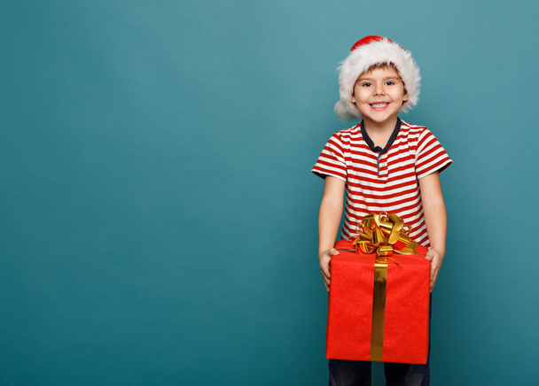 funny child in Santa red - Zdjęcie, obraz