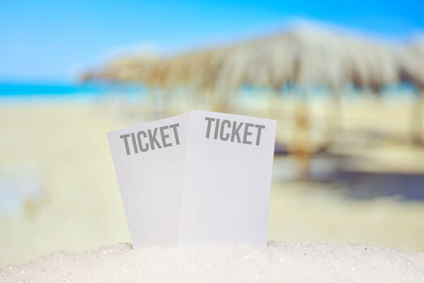 Beautiful blurred view of the beach and sand with travel tickets. - Fotoğraf, Görsel