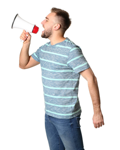Emotional young man with megaphone on white background - Valokuva, kuva