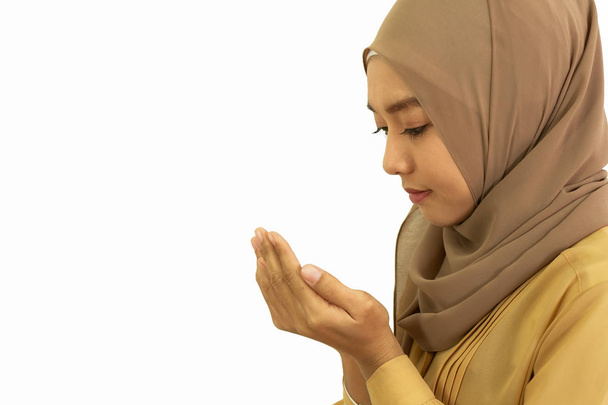 young muslim woman praying dua for allah isolated on white backg - 写真・画像