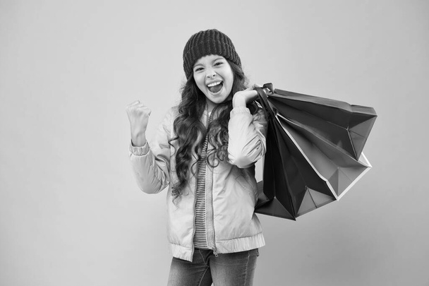 Buyer consumer concept. Christmas sale. Kid fashion. Holiday purchase saving. Home shopping. Small girl with shopping bags. Sales and discounts. Happy child. Little girl with gifts. Winter shopping - Fotoğraf, Görsel