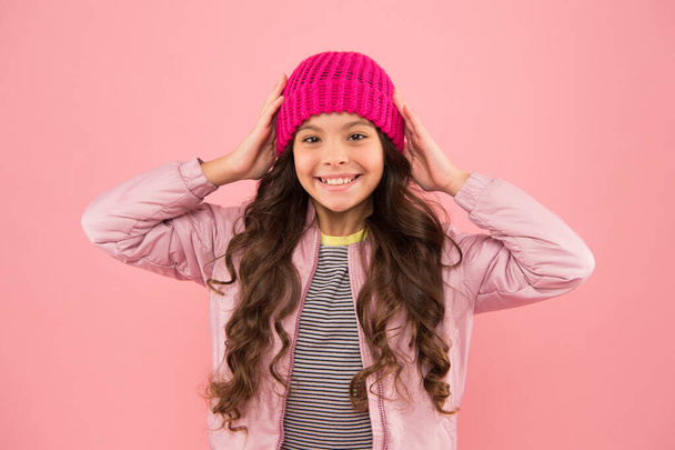 Nice hat. Little kid wear puffer jacket and knitted hat. Winter shopping. Dress warm in winter. Clothing item. Ready for cold winter. Accessories shop. Happy childhood. Trendy accessory. Tender style - Foto, Imagen
