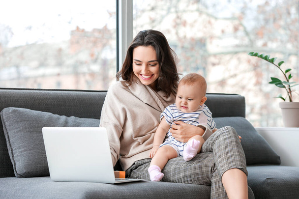 Working mother with her baby in office - Photo, Image