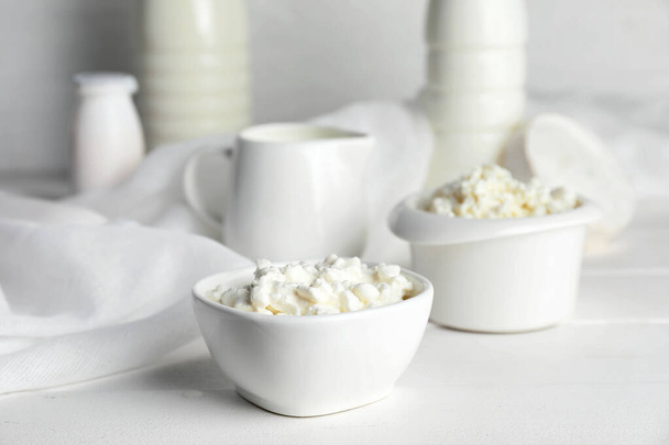 Bowls with cottage cheese on white table - Photo, Image