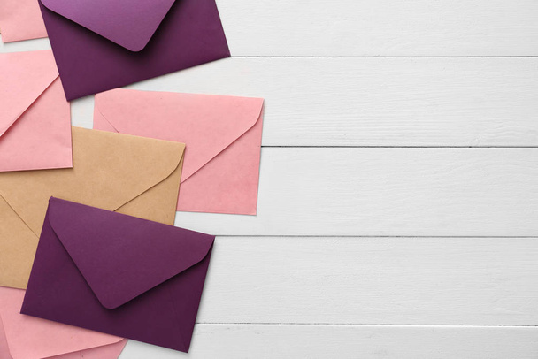 Paper envelopes on wooden background - Foto, imagen