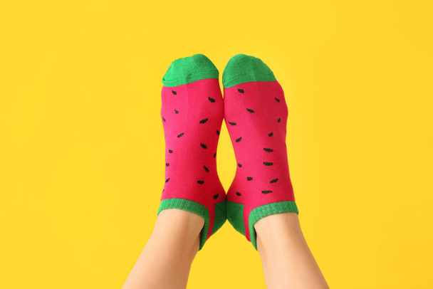 Legs of young woman in socks on color background - Foto, immagini