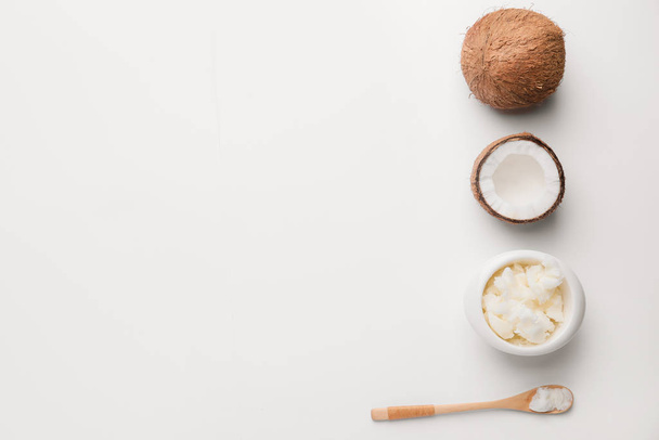 Composition with coconut and butter on light background - Photo, Image