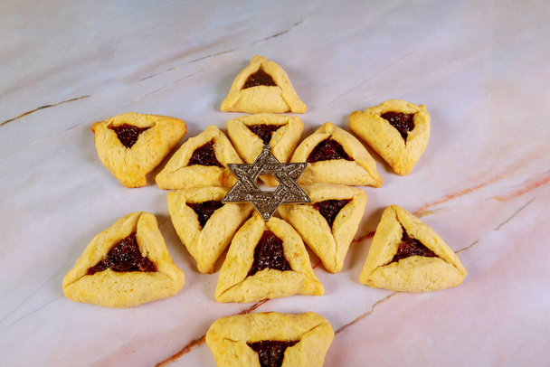 Star of David on purim hamantaschen cookies. - 写真・画像
