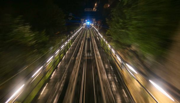 Fast moving funicular in night by long exposure shoot - Photo, Image
